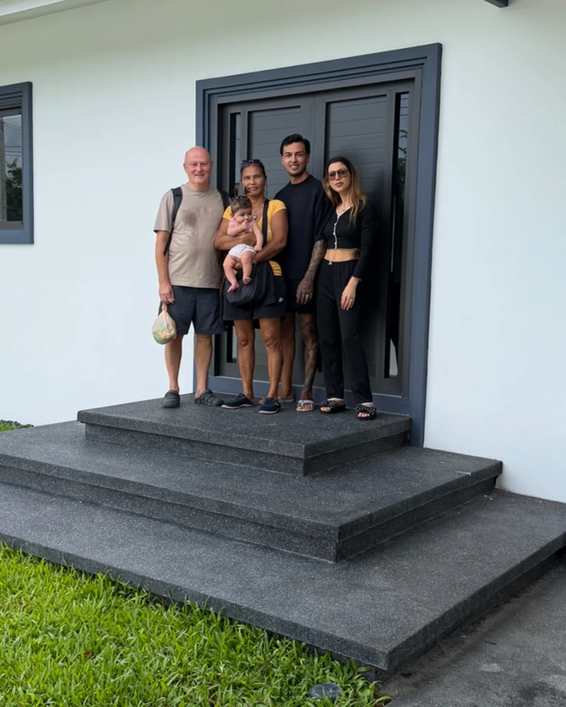 Three generations of the family on the front steps of Onyx Float