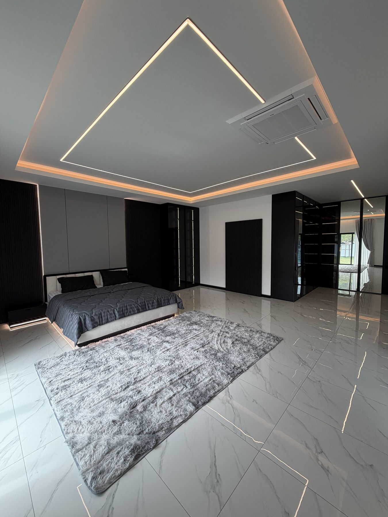 Master suite with bed and walk-in wardrobe